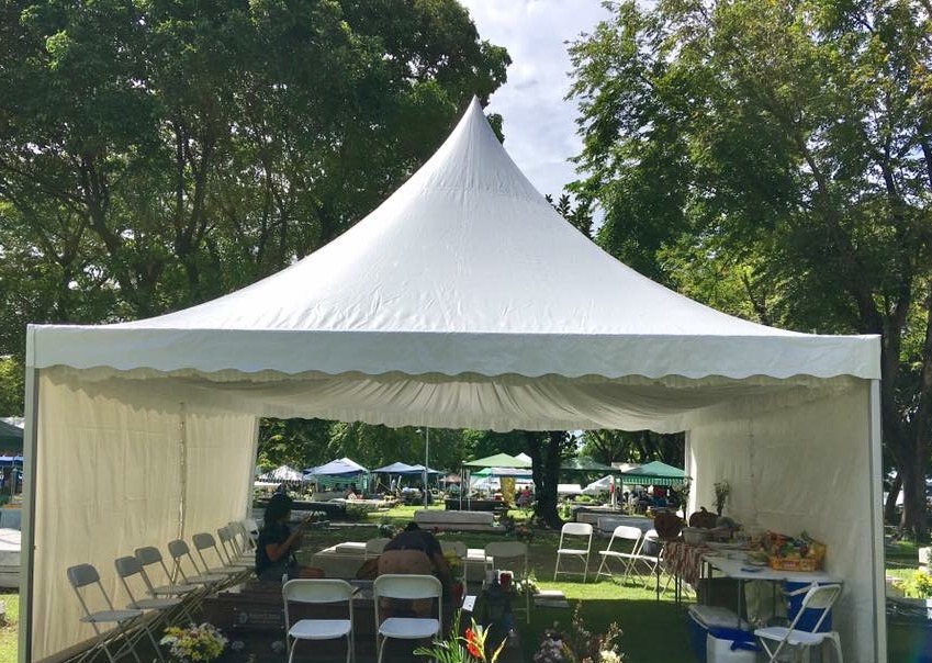 White 6x6 metre pagoda tent with side walls set up in a park for an event